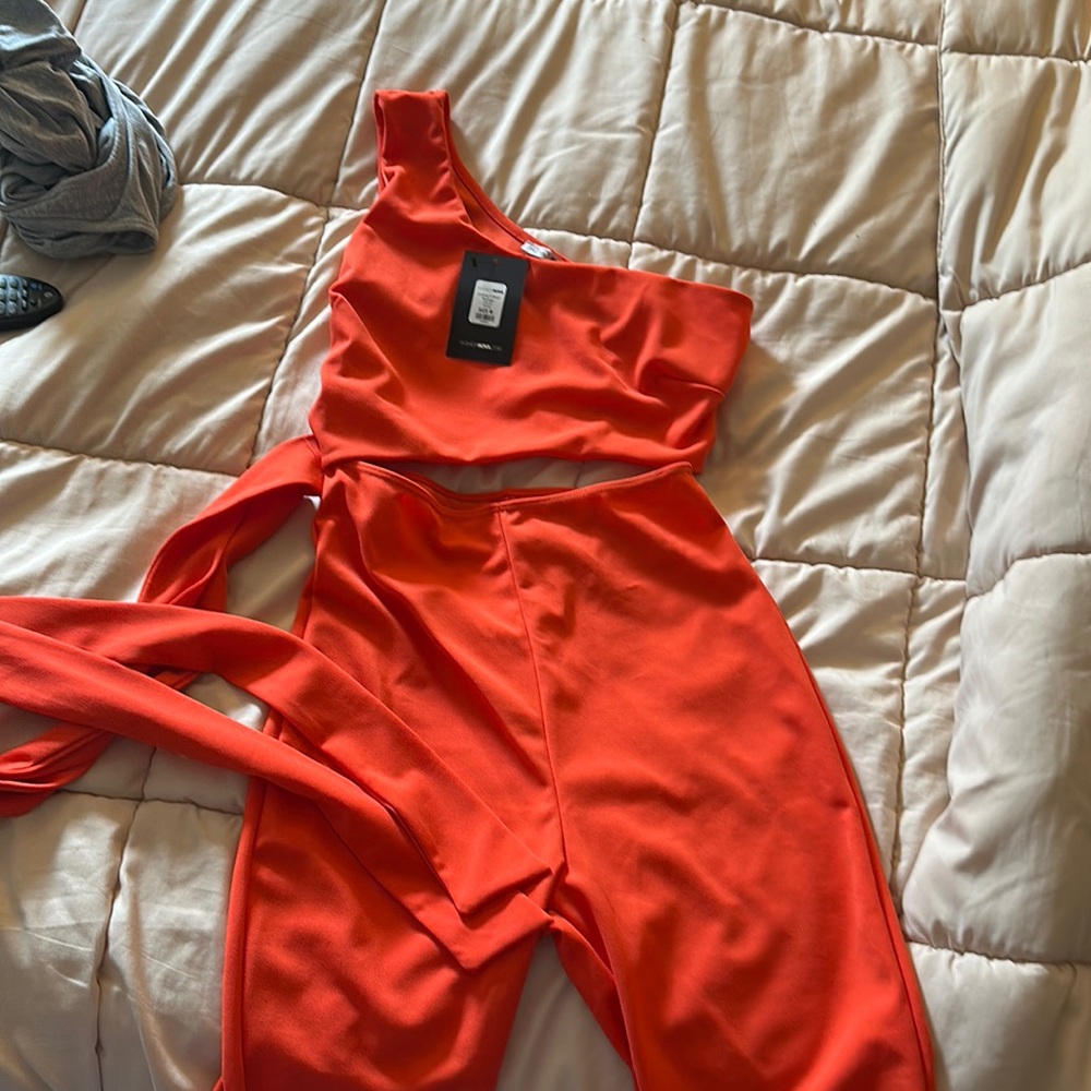 Brand new. Orange romper. Fashion nova